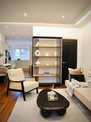 a living room with a couch and a table at Premium 4BR I Near Golf Course I Fast Wi-Fi & Free Parking in Moffat
