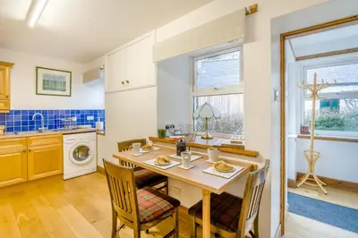a kitchen with a table and chairs in a room at 3 Bed in New Galloway oc-r34387 in New Galloway