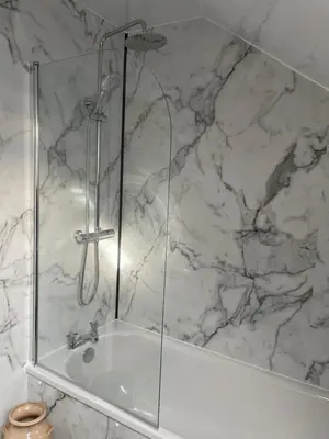 a shower with a glass enclosure in a bathroom at West Coast Whistlestop in Ochiltree