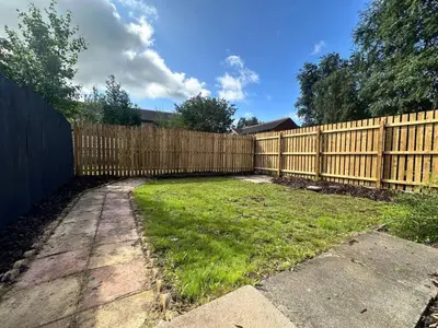 a wooden fence in front of a yard at Oakleigh Way, Carlisle - 2 Bedroom, sleeps 4, Fully furnished in Carlisle