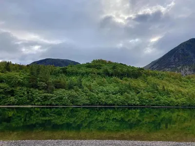 a body of water with mountains in the background at Scale Hill Hotel in Loweswater