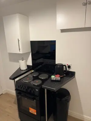 a kitchen with a stove and a counter top at Work-Ready House Near Sellafield in Cleator Moor