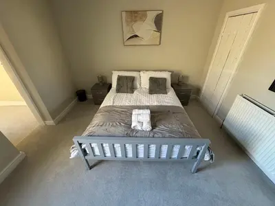 a bedroom with a large bed in a room at Work-Ready House Near Sellafield in Cleator Moor