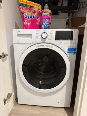 a white washing machine with snacks on top of it at Chalk in Moffat