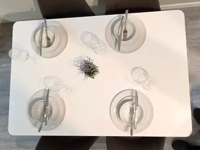 a table with wine glasses and flowers on it at One Old Creamery in Sandhead