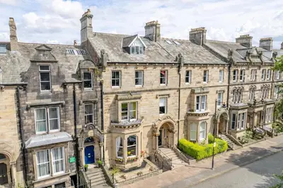 a large stone building on a city street at Portland Square in Carlisle