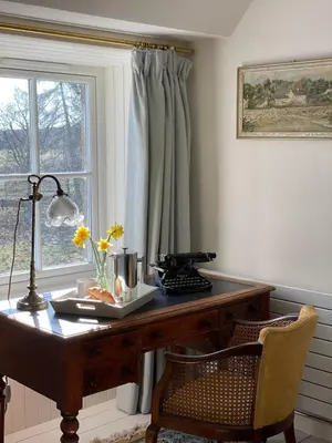 an office with a wooden desk and a window at Keeper's Cottage at Slogarie Estate in Castle Douglas
