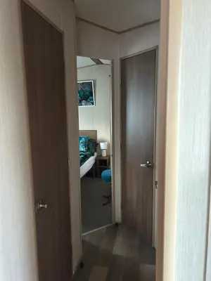 a hallway with a door leading to a bedroom at BZ Green Haven Caravan in Ballantrae