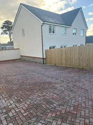 a white house with a fence and a brick driveway at 3,Lime Tree Ave in Moffat