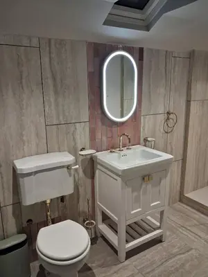 a bathroom with a toilet and a sink and a mirror at Drakes Rest, Kirklinton with hot tub, ideal romantic escape in Kirklinton