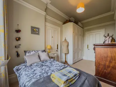a bedroom with a bed with towels on it at Eden Mount, Wetheral, characteful, spacious home overlooking village green, close to M6 in Wetheral