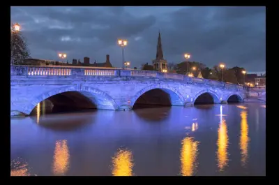 a blue bridge over a river at night at Contractor ready two bedroom flat in Moffat