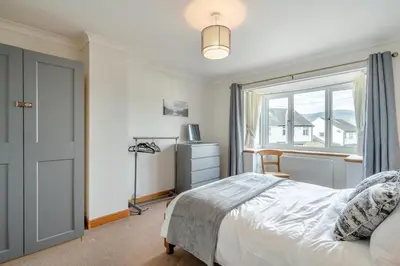 a bedroom with a bed and a large window at 3 Bed in Portinscale oc-w31059 in Portinscale