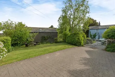 a backyard with a brick driveway and a house at 2 Bed in Dean oc-h32066 in Dean