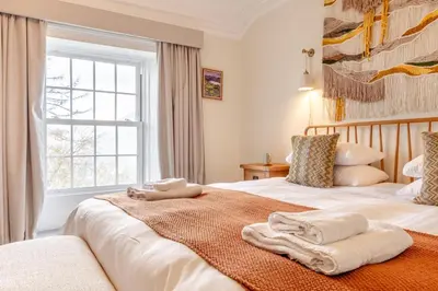 a bedroom with two beds with towels on them at 5 Bed in Keswick oc-h33619 in Keswick