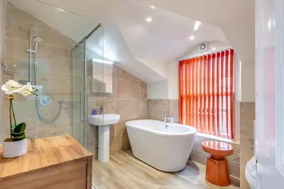 a bathroom with a tub and a sink and a shower at 5 Bed in Keswick oc-h33619 in Keswick