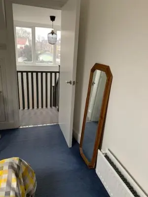 a mirror in the corner of a room at Crouch End in Moffat