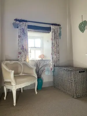a room with a chair and a window at Highside farm in Embleton