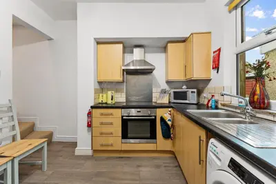 a kitchen with a sink and a stove top oven at Vintage 2 Bed House in Lamplugh in Lamplugh