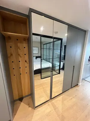 a room with sliding glass doors and a bedroom at Modern City Apartment, Fast Wi-Fi, Great View in Moffat