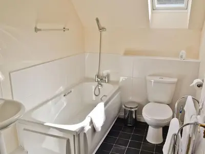 a bathroom with a tub and a toilet and a sink at Holiday Home Gehöft 2 by Interhome in Tweedsmuir