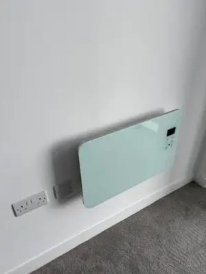 a white shelf with a mirror on a wall at Skyline view 2 bedroom apartment in Moffat