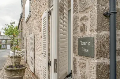 a brick building with a sign that reads temple black at Luxurious Barn within easy reach of South Lakes! in Boot