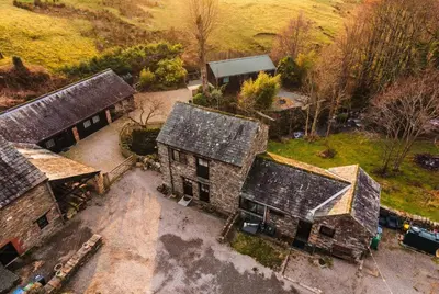 an overhead view of an old house with roofs at Stables Cottage - Wythop Mill in Embleton