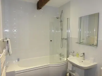 a bathroom with a tub and a sink and a shower at Centurion, Irthington on Hadrians Wall in Irthington