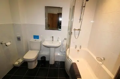 a bathroom with a toilet and a sink and a bath tub at Turret, Irthington on Hadrians Wall in Irthington