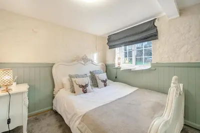 a bedroom with a white bed and a window at 6 Bed in Low Moresby oc-l34667 in Distington
