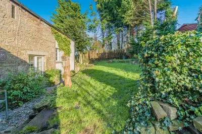 a yard with a brick house and a yard at 6 Bed in Low Moresby oc-l34667 in Distington