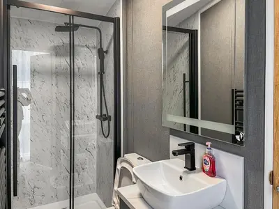 a bathroom with a sink and a shower at Blencathra View - Uk50085 in Penruddock