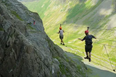 two people walking on a rope on a mountain at Wordsworth Cottage in Keswick