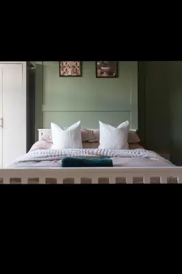 a large white bed with two pillows on it at Comfortable Carlisle Stay with Free Parking in Carlisle