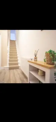 a staircase in a room with a stair case at Comfortable Carlisle Stay with Free Parking in Carlisle