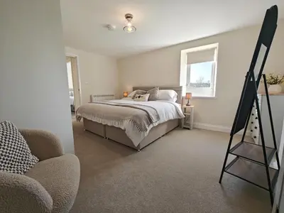 a bedroom with a bed and a easel in it at 4 Bed in Ireby oc-p34997 in Ireby