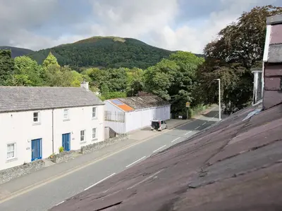 an aerial view of a street with houses and a mountain at 22 Rose Terrace in Keswick