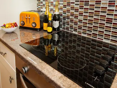a kitchen counter with bottles of wine on it at 22 Rose Terrace in Keswick