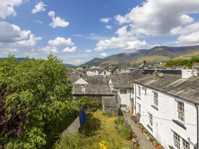 a view of a village with mountains in the background at Mary's Cottage in Keswick
