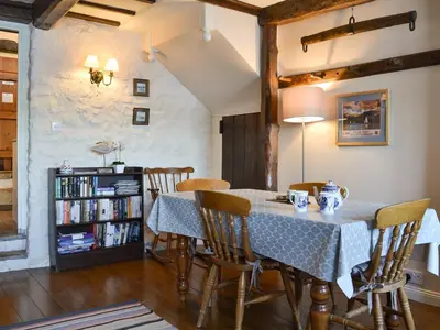 a dining room with a table and chairs at Branthwaite Stable in Caldbeck
