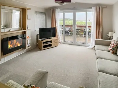 a living room with a tv and a fireplace at The View in Stranraer