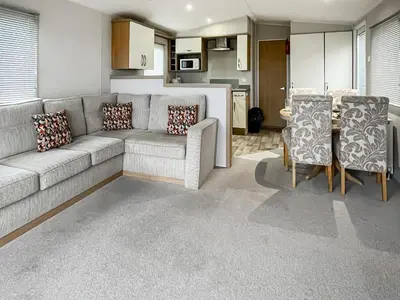 a living room with a couch and a table and chairs at The View in Stranraer
