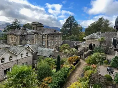 a large mansion with a garden in front of it at Underscar - Scafell in Applethwaite