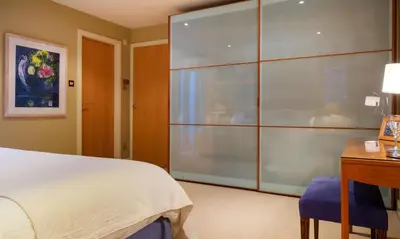 a bedroom with a bed and a desk and a window at Underscar - Scafell in Applethwaite