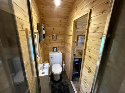 a small bathroom with a toilet and a sink at Raiders Rest - near pub and shop in Palnackie