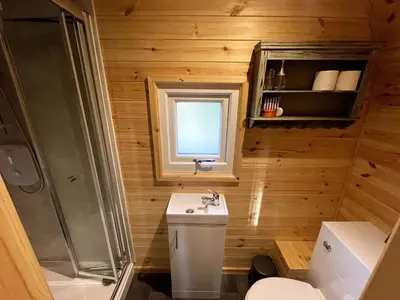 a bathroom with a toilet and a sink and a shower at Raiders Rest - near pub and shop in Palnackie