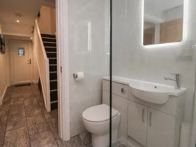 a bathroom with a toilet and a sink at 6 Hallin Fell in Watermillock