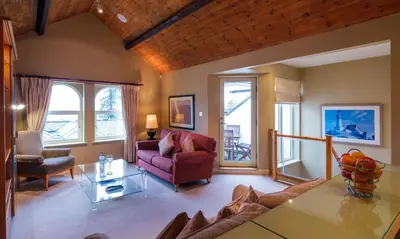 a living room with a couch and a table at Watendlath in Applethwaite