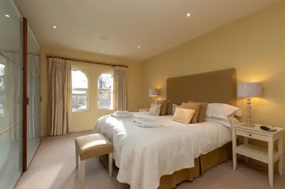 a bedroom with a large bed and a window at Underscar - Ashness in Applethwaite